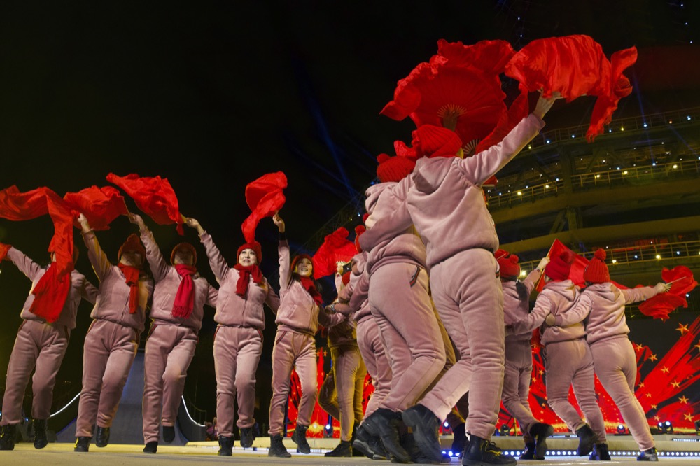 Performers rehearse before a New Year’s Eve countdown event at the 2022 Beijing Winter Olympic headquarters in Bejiing, Tuesday, Dec. 31, 2019. Revelers around the globe are bidding farewell to a decade that will be remembered for the rise of social media, the Arab Spring, the #MeToo movement and, of course, President Donald Trump. (AP Photo/Ng Han Guan)