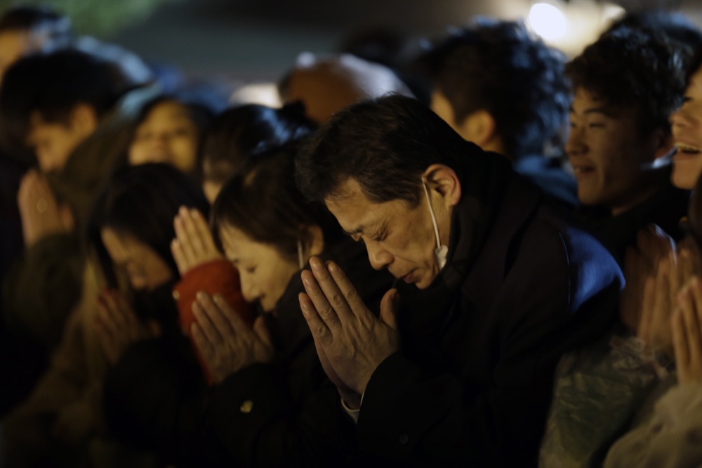 People offer their new year’s prayers at the Meiji Jingu Shinto shrine as they celebrate the arrival of the year 2020, Wednesday, Jan 1, 2020, in Tokyo. (AP Photo/Kiichiro Sato)