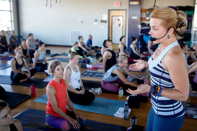 Staff photo by C.B. Schmelter / Heather Dendy, right, talks to her class at Southern Soul Yoga on Tuesday, Dec. 31, 2019 in Chattanooga, Tenn. Dendy co-owns the studio with Sara Mingus.
