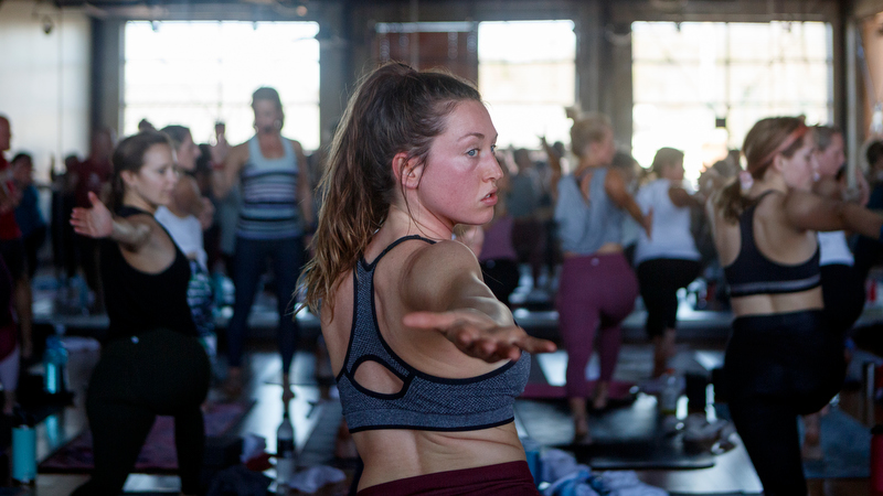 Staff photo by C.B. Schmelter / Clara Pruett, center, takes part in Heather Dendy's yoga class at Southern Soul Yoga on Tuesday, Dec. 31, 2019 in Chattanooga, Tenn. Dendy co-owns the studio with Sara Mingus.