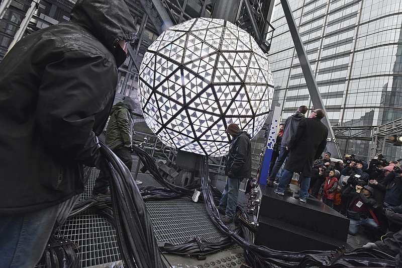 The Times Square New Year's Eve Ball at 12 feet in diameter and weighing 11,875 lbs, covered with 2,688 "Gift of Goodwill" designed Waterford Crystal triangles, is tested before the official Times Square Celebration in New York, NY, December 30, 2019. (Anthony Behar/Sipa USA)(Sipa via AP Images)