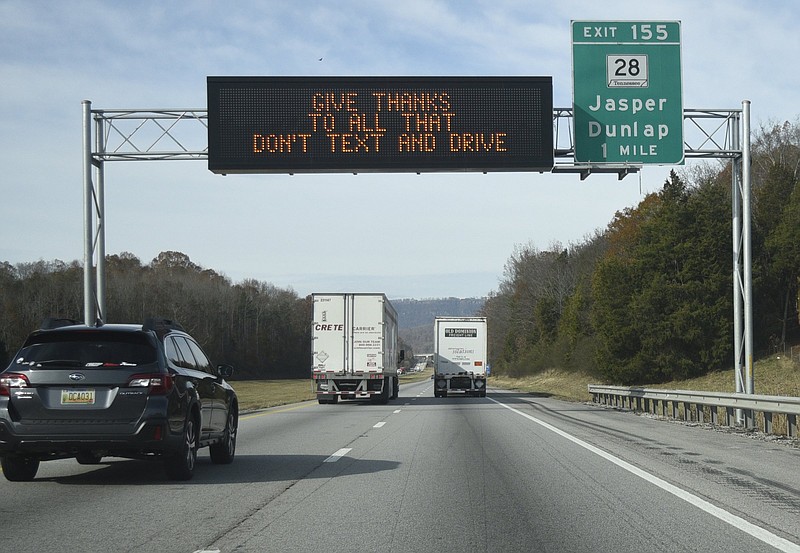 Staff Photo by Robin Rudd/  A state of Tennessee informational sign cautions against driving and texting along I-24 near Jasper, Tennessee, on Tuesday, November 26, 2019.