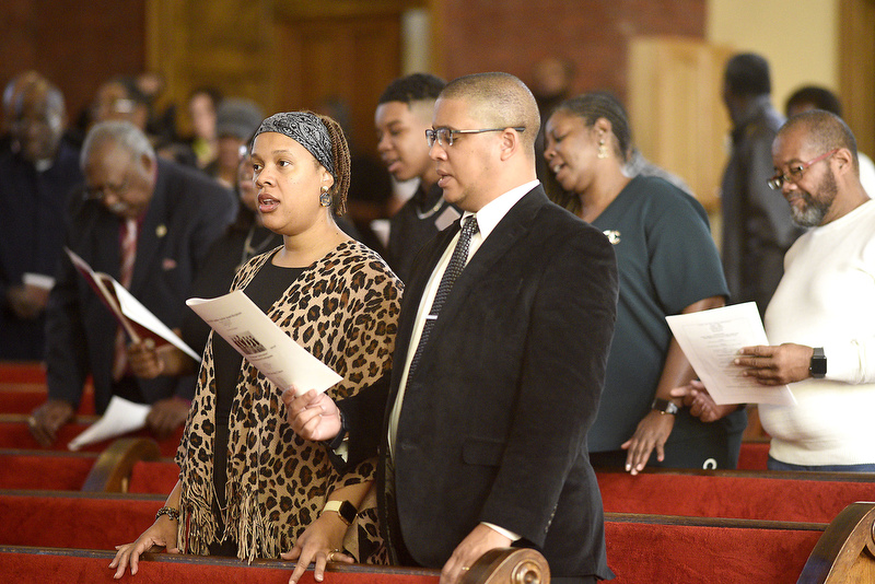 Staff Photo by Robin Rudd/   The attendees sing the Black National Anthem.