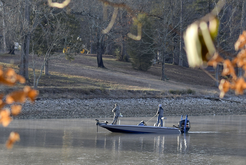Staff Photo by Robin Rudd/   Two fishermen fish in the early morning light of 2020 along the hike's route.  Booker T. Washington State Park kicked off the new year and decade hosting a two-mile first day hike on January 1, 2020.