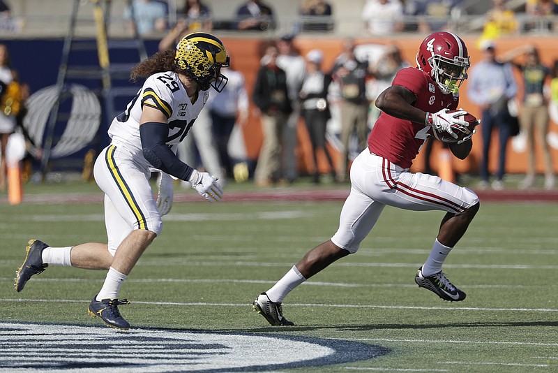 Alabama wide receiver Jerry Jeudy leaves Michigan linebacker Jordan Glasgow behind after making a catch during the first half of the Citrus Bowl on Wednesday in Orlando, Fla. Jeudy finished the game with 204 receiving yards on six catches, including an 85-yard touchdown. / AP photo by John Raoux