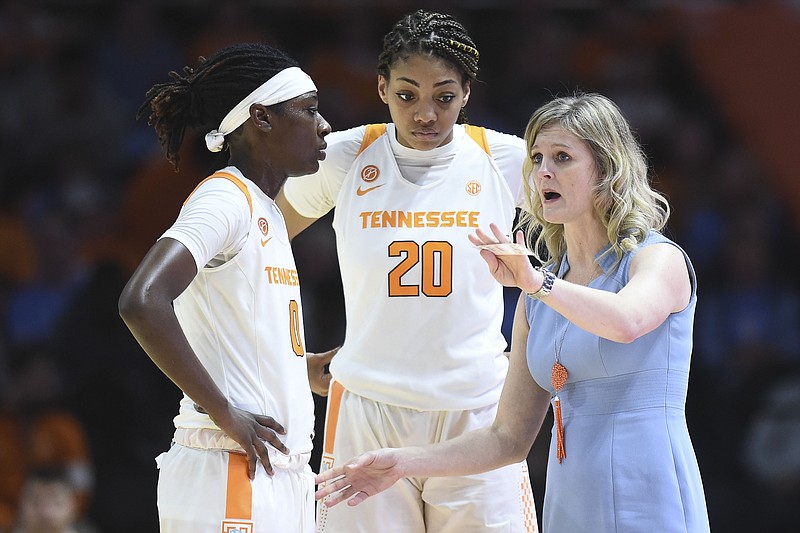 Tennessee women's basketball coach Kellie Harper talks with Rennia Davis, left, and Tamari Key during Sunday's home game against Howard. The Lady Vols won 88-38 in their final contest before beginning their SEC schedule for this season. / AP photo by Saul Young