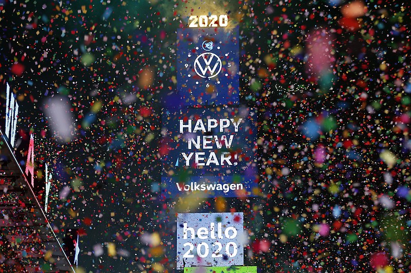 Confetti falls during a New Year's celebration in New York's Times Square, Wednesday, Jan. 1, 2020. (AP Photo/Adam Hunger)