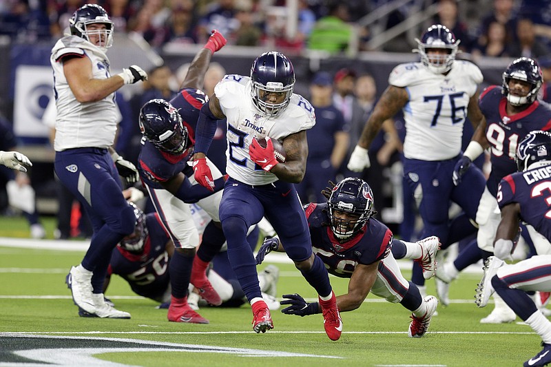 Tennessee Titans running back Derrick Henry breaks away from Houston Texans linebacker Peter Kalambayi, right, and other defenders to run for a 53-yard touchdown during the second half of last Sunday's game in Houston. The Titans won 35-14 to clinch a postseason berth, and Henry finished the regular season as the league's leading rusher with 1,540 yards in 15 games. / AP photo by Michael Wyke