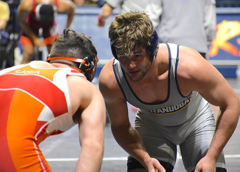 UTC wrestler Matthew Waddell, right, shown during the Mocs' Southern Scuffle tournament earlier this month, when he finished fourth in the 184-pound weight class, won a title Saturday at Appalachian State's tournament. / Staff photo by Patrick MacCoon