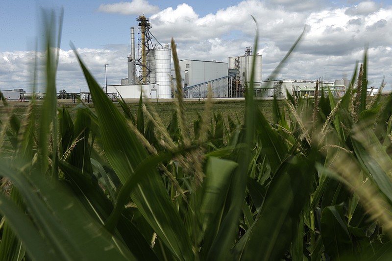 In this July 20, 2013, file photo, an ethanol plant stands next to a cornfield near Nevada, Iowa. Some farm groups and farm-state lawmakers are expressing anger at the Trump administration over final ethanol rules that they say fail to uphold the president's promises to the industry. The Environmental Protection Agency has released final renewable fuel standard rules for next year that do not include language President Donald Trump agreed to that would guarantee 15 billion gallons of ethanol is blended into the nation's gasoline supply. (AP Photo/Charlie Riedel, File)