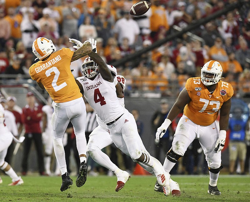 Indiana linebacker Cam Jones pressures Tennessee quarterback Jarrett Guarantano during the second quarter of the TaxSlayer Gator Bowl on Thursday night in Jacksonville, Fla. Guarantano's pass was intercepted. / AP photo by Bob Self