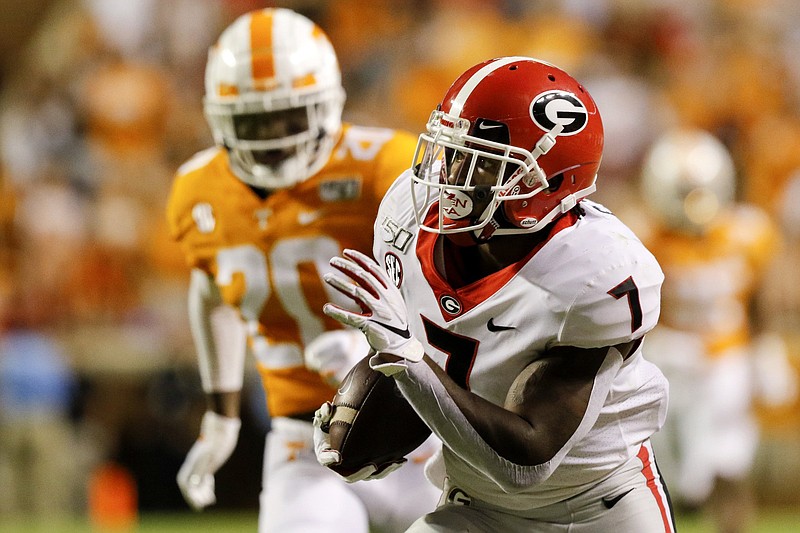 Staff photo by C.B. Schmelter / Georgia junior running back D'Andre Swift, shown during a 44-yard gain on a catch during the 43-14 win at Tennessee in October 2019, is in the NFL draft pool after three seasons with the Bulldogs.