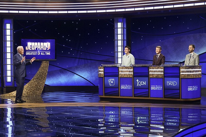In this image released by ABC, host Alex Trebec, left, appear with contestants, James Holzhauer, center, Ken Jennings and Brad Rutter, right, on the set of "Jeopardy! The Greatest of All Time," in Los Angeles. The all-time top "Jeopardy!" money winners; Rutter, Jennings and Holzhauer, will compete in a rare prime-time edition of the TV quiz show which will air on consecutive nights beginning 8 p.m. EDT Tuesday. (Eric McCandless/ABC via AP)

