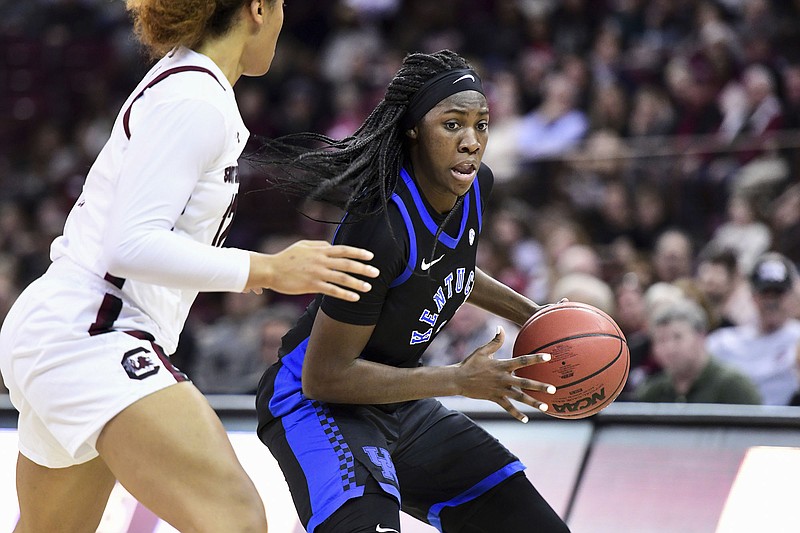 Kentucky sophomore guard Rhyne Howard, with ball, tries to work her way around South Carolina's Breanna Beal on Thursday in Columbia, S.C. Howard, a former Bradley Central standout, scored 28 points for the Wildcats in a 99-72 loss to open SEC play. / AP photo by Sean Rayford