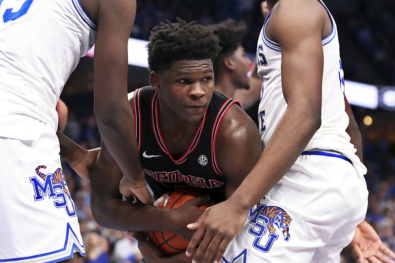 Georgia guard Anthony Edwards, center, grabs a rebound during the first half of Saturday's game at Memphis. / AP photo by Karen Pulfer Focht