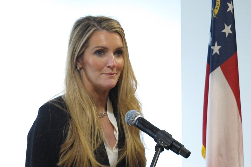 Republican businesswoman Kelly Loeffler, who will soon be Georgia's next U.S. senator, speaks to reporters at the Port of Savannah on Thursday, Jan. 2, 2020, in Savannah, Georgia. Loeffler is scheduled to be sworn in when the Senate convenes Monday, Jan. 6 in Washington. She was chosen by Gov. Brian Kemp to fill the seat of GOP Sen. Johnny Isakson, who left office at the end of 2019 because of health problems. (AP Photo/Russ Bynum)