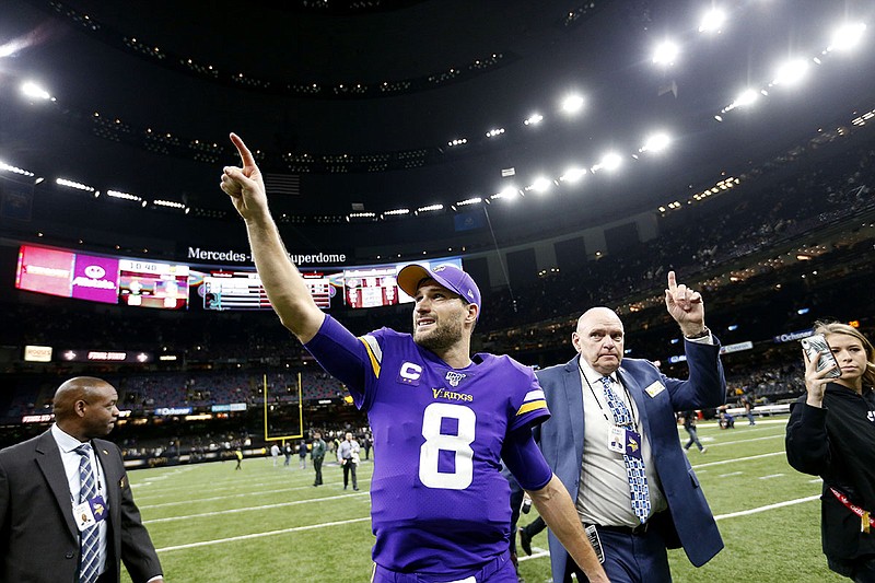 Minnesota Vikings quarterback Kirk Cousins points to the stands as he walks off the field at the Superdome after the team's overtime victory against the New Orleans Saints on Sunday. The Vikings won 26-20. / AP photo by Butch Dill