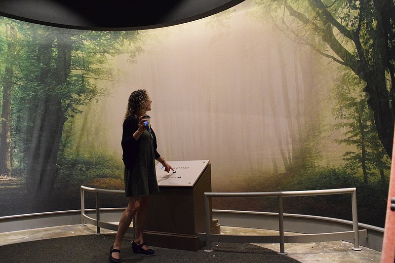 An exhibit designer at the Sequoyah Birthplace Museum in Vonore, Tennessee, which lies on land that would be returned to the Cherokee Indians if a bill in Congress get Senate approval, starts an audi-visual presentation. / Staff File Photo By Ben Benton