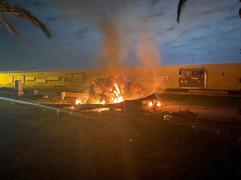 Photo from the Iraqi Prime Minister's Press Office via The New York Times / A photo released by the Iraqi Prime Minister's Press Office shows the burning wreckage of a vehicle following an American drone strike outside the Baghdad airport on Friday, Jan 3, 2020. Maj. Gen. Qasem Soleimani was killed in the drone strike. United States officials have justified the assassination as retribution for the general's actions and deterrence of future American deaths.