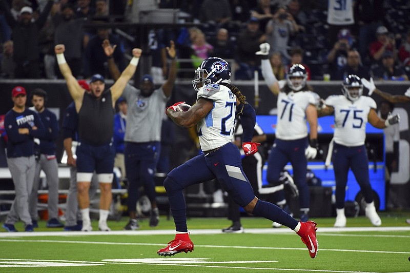 Tennessee Titans running back Derrick Henry (22) rushes for a 53-yard touchdown against the Houston Texans during the second half of an NFL football game Sunday, Dec. 29, 2019, in Houston. Henry's run put him into first place for the season rushing title. (AP Photo/Eric Christian Smith)