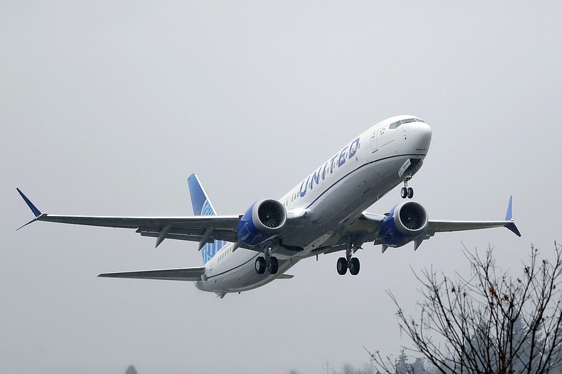 FILE - In this Dec. 11, 2019, file photo, an United Airlines Boeing 737 Max airplane takes off in the rain at Renton Municipal Airport in Renton, Wash. Boeing said Tuesday, Jan, 7, 2020, it is recommending that pilots receive training in a flight simulator before the grounded 737 Max returns to flying, a reversal of the company's long-held position that computer-based training alone was adequate. The 737 Max has been grounded worldwide since last March after two crashes killed 346 people. (AP Photo/Ted S. Warren, File)