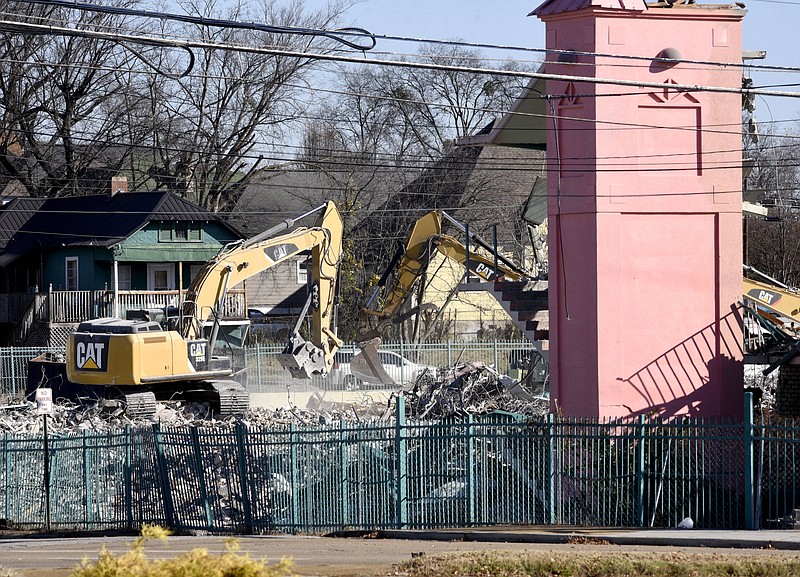 Staff Photo by Robin Rudd / A stairwell is all that remains erect of the Chatt City Suites as demolition, by McKinley Excavating, continues on the East 20th Street long-stay motel on December 4, 2019. The facility, that housed low-income residents, was closed in January.