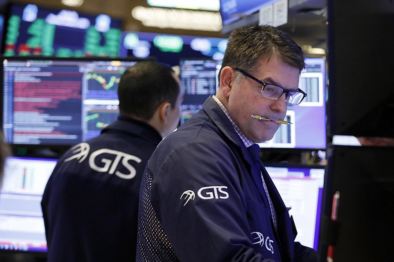 Specialist David Haubner works on the floor of the New York Stock Exchange, Thursday, Jan. 9, 2020. Stocks are opening broadly higher on Wall Street as traders welcome news that China's top trade official will head to Washington next week to sign a preliminary trade deal with the U.S. (AP Photo/Richard Drew)