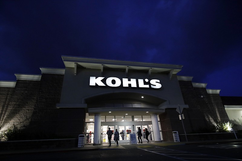 FILE - In this Nov. 29, 2019, file photo customers walk outside of a Kohl's store in Colma, Calif. Mall-based retailers J.C. Penney, Kohl's and Victoria's Secret parent reported sales declines for the holiday season, underscoring  continued challenges ahead from online rivals. (AP Photo/Jeff Chiu, File)