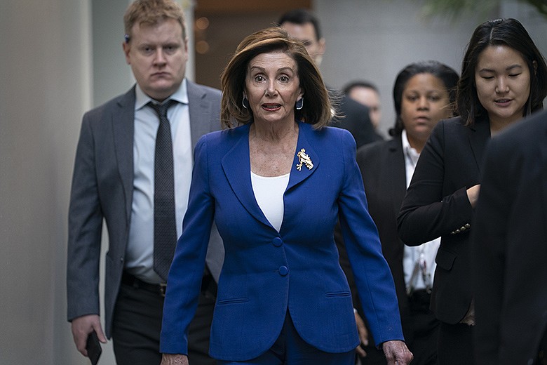 Speaker of the House Nancy Pelosi, D-Calif., arrives to meet with other House Democrats on the morning following Iranian attacks on bases in Iraq housing U.S. troops, at the Capitol in Washington, Wednesday, Jan. 8, 2020. (AP Photo/J. Scott Applewhite)