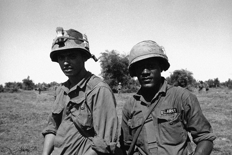Pfc. Daniel A. Rouseau, 20, left, of Willimansett, Mass., and Sp. 5 Willy H. Brown, 23, of Fort Mill, S.C., are a pair of Heroic Medics with a company, 1st battalion, 27th Infantry, U.S. 25th infantry division. Their outfit was pinned down, for four hours after a helicopter assault landing north of Saigon in Vietnam on Jan. 9, 1967. They and two other medics worked on the wounded all throughout the battle. All have been recommended for decorations by their commanding officer. (AP Photo)

