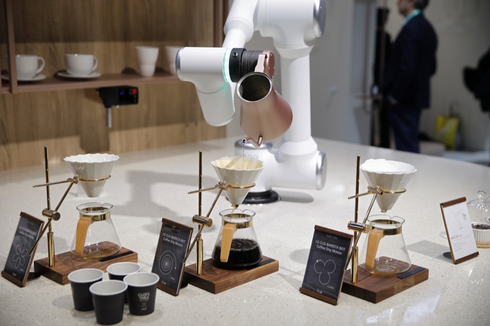 A LG CLOi CoBot Barista makes coffee in a mock restaurant setting at the LG booth during the CES tech show, Tuesday, Jan. 7, 2020, in Las Vegas. (AP Photo/John Locher)