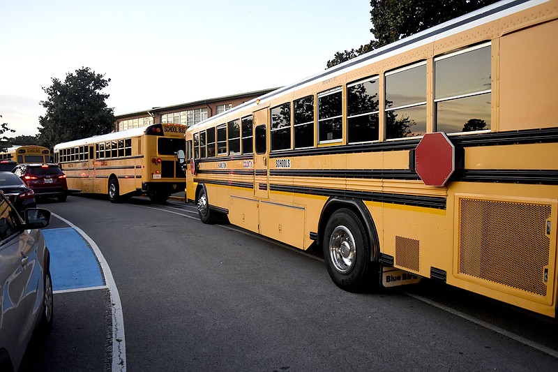 Staff Photo by Robin Rudd/  Buses arrive for the first day of classes at East Ridge High and Middle Schools.  The first day for Hamilton County Schools saw changed starting times for some schools on August 7, 2019.