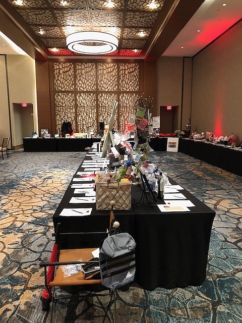 Items are displayed for bidding at the 2019 Red & Black Auction at The Westin Chattanooga. / Contributed photo by Arlina Hensley