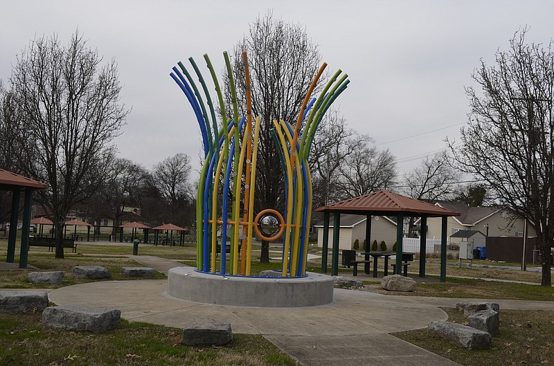 A recently installed interactive sculpture, "re: Pete," is the focal point of Tatum Park in the Highland Park neighborhood. A project of the city's Art in Neighborhoods program, the sculpture's inspiration is a peacock known as Pete that mysteriously appeared in the neighborhood. / Staff photo by Emily Crisman