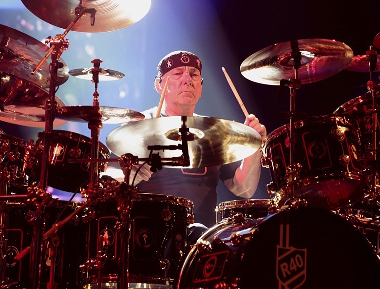 This June 25, 2015, file photo shows Neil Peart of the band Rush performing in concert during their R40 Live: 40th Anniversary Tour in Philadelphia. Peart, the renowned drummer and lyricist from the band Rush, has died. His rep Elliot Mintz said in a statement Friday that he died at his home Tuesday, Jan. 7, 2020, in Santa Monica, Calif. He was 67. (Photo by Owen Sweeney/Invision/AP, File)