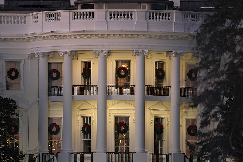 In this Dec. 5, 2019 photo, a view of the south side of the White House in Washington decorated for Christmas. The Associated Press-NORC Center for Public Affairs Research poll released Friday finds only about 1 in 10 Americans expect a downturn in their own lives in 2020. But about 4 in 10 say the way things are going nationwide will get worse in the year ahead. 2020 is an election year, and that might have something to do with it: Most Democrats and Republicans alike say they're dissatisfied with the state of politics. (AP Photo/Susan Walsh)