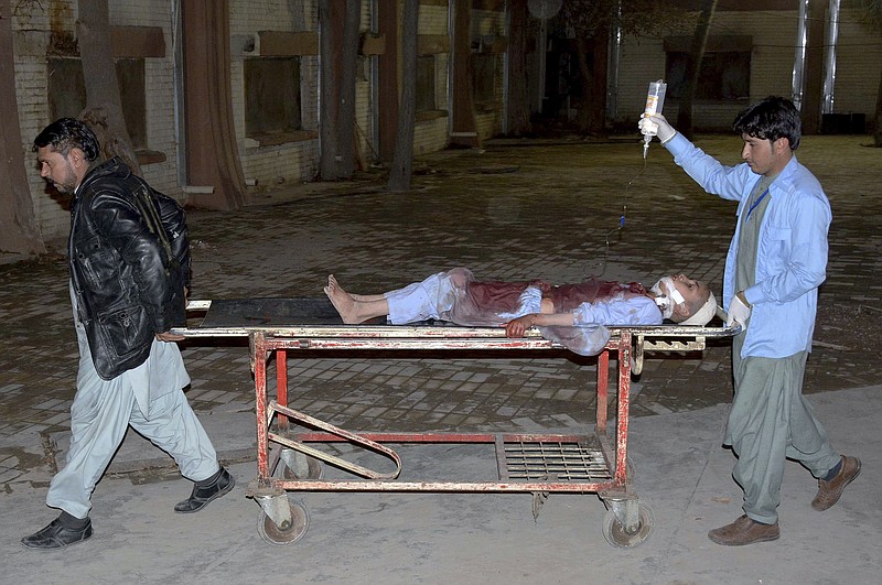 A boy, who was injured in the mosque bombing, is transported at a hospital in Quetta, Pakistan, Friday, Jan. 10, 2020. A powerful explosion ripped through a mosque in southwest Pakistan during Friday evening prayers, killing a senior police officer with some civilians and wounded other worshipers, police said. (AP Photo/Arshad Butt)