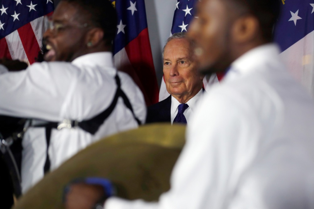 Democratic Presidential candidate and former New York City Mayor Michael Bloomberg looks on as a drumline plays before speaking during a rally Friday, Jan. 10, 2020, in Atlanta. (AP Photo/John Bazemore)