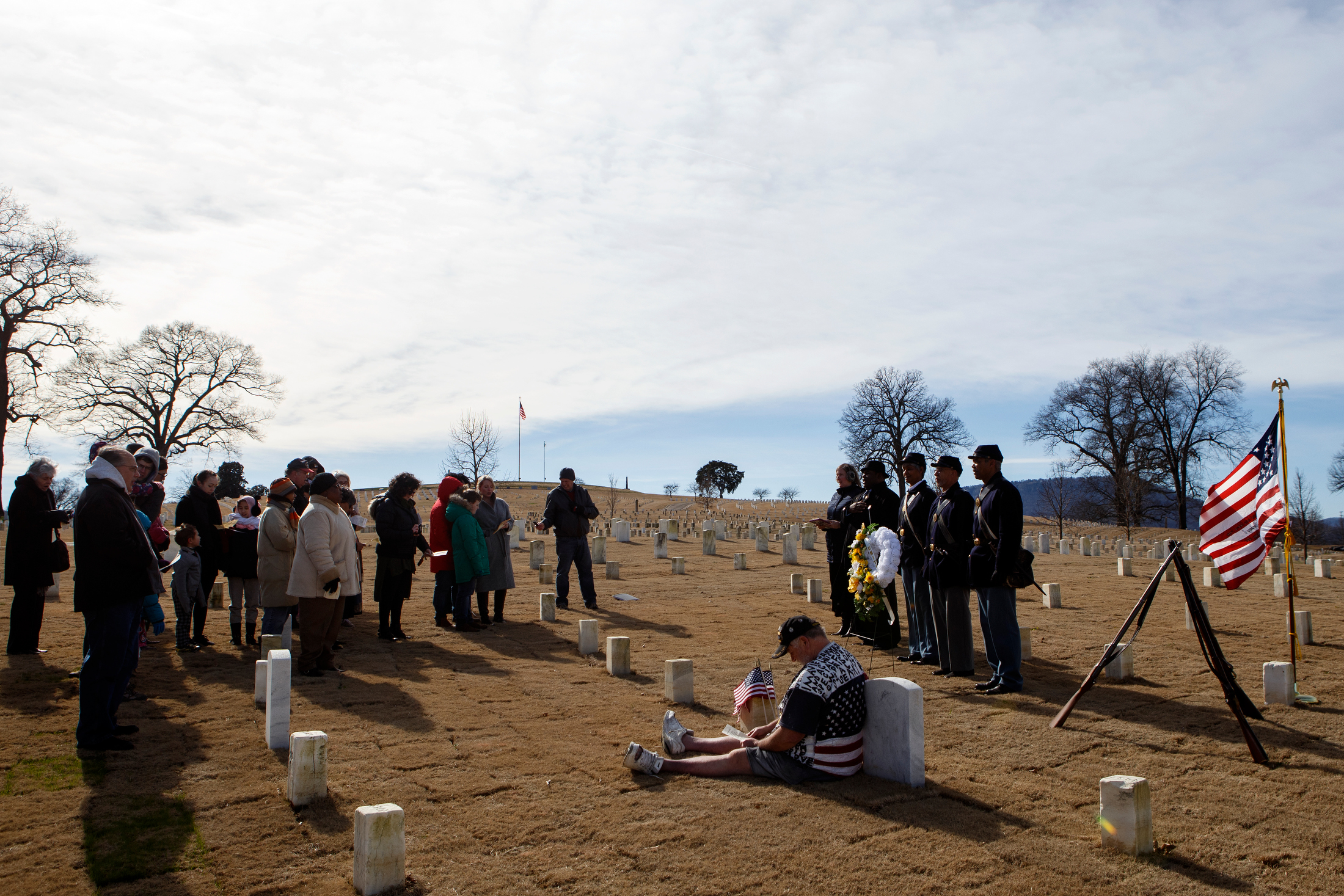People gathered for the wreath laying at the Chattanooga National Cemetery, as part of the Martin Luther King Jr. Day of Service, sing a verse from the "Battle Hymn of the Republic" on Monday, Jan. 21, 2019 in Chattanooga, Tenn. Hosted by Unity Group of Chattanooga, along with National Park Partners, the 44th United States Colored Troops reeenactors and the Mary Walker Historical and Educational Foundation, the wreath was laid to honor the members of the United States Colored Troops who fought in the Civil War and helped erect the Chattanooga National Cemetery.
