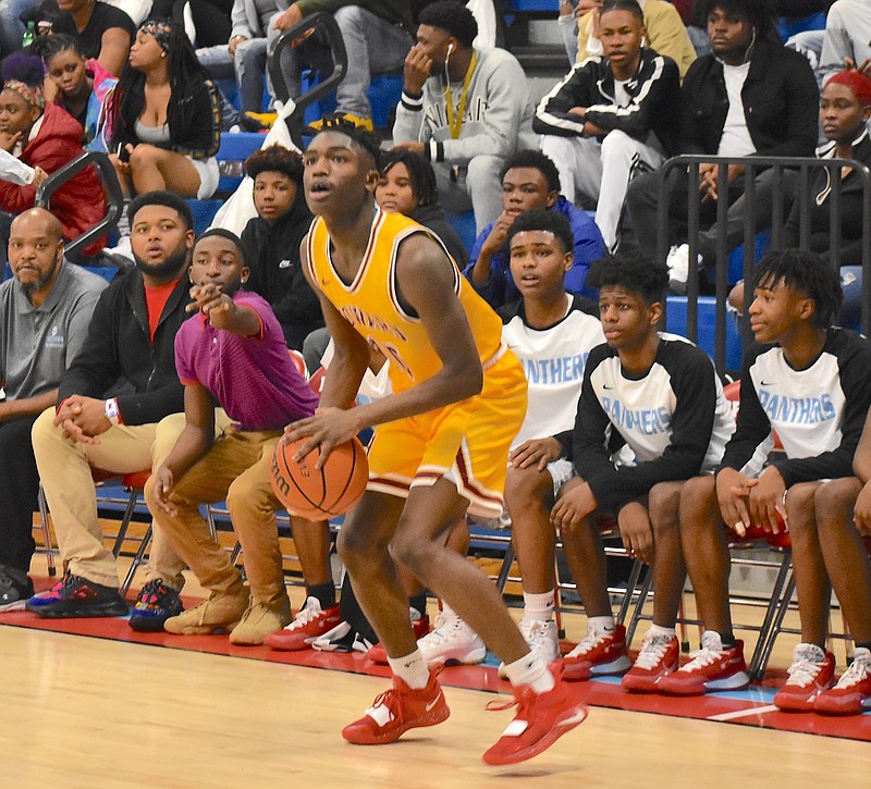 Howard's Meechie Bowens lines up to knock down one of his five 3-pointers in a district road win over Brainerd on Saturday. / Staff photo by Patrick MacCoon