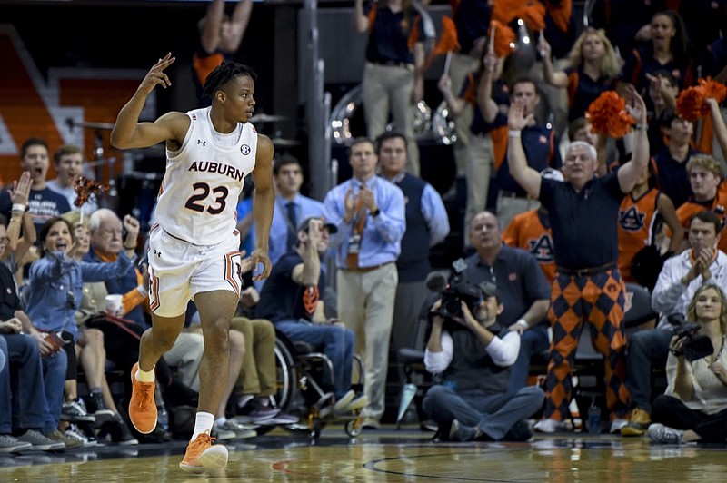 Auburn forward Isaac Okoro (23) celebrates a 3-point shot against Georgia during the first half of an NCAA college basketball game Saturday, Jan. 11 2020, in Auburn, Ala. (AP Photo/Julie Bennett)

