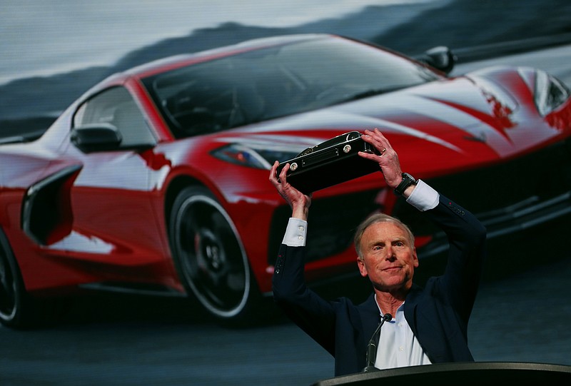 Tadge Juechter, Corvette executive chief engineer, holds up the trophy after the new mid-engine Chevrolet Corvette was named the North American Car of the Year in Detroit, Monday, Jan. 13, 2020. The Kia Telluride took Sport Utility of the Year honors and the Jeep Gladiator won the Truck of the Year Award. (AP Photo/Paul Sancya)