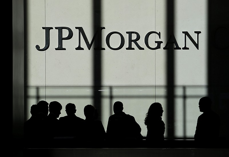 FILE - In this Oct. 21, 2013, file photo, the JPMorgan Chase logo is displayed at their headquarters in New York. Banking giant JPMorgan Chase said that its fourth-quarter profits jumped 21% from a year earlier, as the bank's trading desks had a blowout quarter. A sharp increase in JPMorgan's trading business made up for declining interest rates, which impacted other parts of the bank. (AP Photo/Seth Wenig, File)