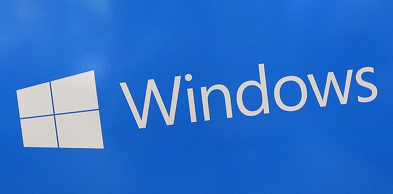 FILE - This Aug. 7, 2017, file shows a Microsoft Widows sign on display at a store in Hialeah, Fla. The National Security Agency has discovered a major security flaw in Microsoft's Windows operating system. Microsoft says the NSA notified the company about it. A fix was made available Tuesday, Jan. 14, 2020. (AP Photo/Alan Diaz)