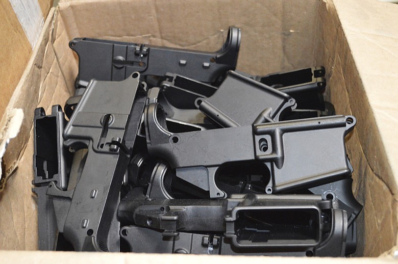 This photo provided by the U.S. Department of Justice shows AR-15 lower receivers, which federal agents have seized, including these unfinished ones taken in 2014 in California, for firearms investigations nationwide. For decades, the federal government has treated the mechanism called the lower receiver as the essential piece of the semiautomatic rifle, which has been used in some of the nation's deadliest mass shootings. But some defense attorneys have recently argued that the part alone does not meet the definition in the law. (U.S. Department of Justice via AP)