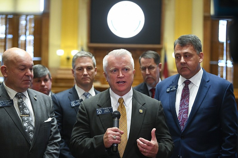 New state Sen. Randy Robertson, R-Cataula, center, is flanked by Majority Leader Mike Dugan, R-Carrollton, left, and Majority Whip Steve Gooch, R-Dahlonega, right, as he speaks to the media during the opening day of the year for the general session of the state legislature, Monday, Jan. 13, 2020, in Atlanta. (AP Photo/John Amis)


