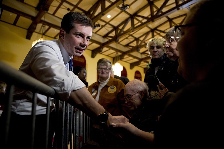 Democratic presidential candidate former South Bend, Ind., Mayor Pete Buttigieg greets members of the audience at a campaign stop at Iowa State University, Monday, Jan. 13, 2020, in Aimes, Iowa. (AP Photo/Andrew Harnik)