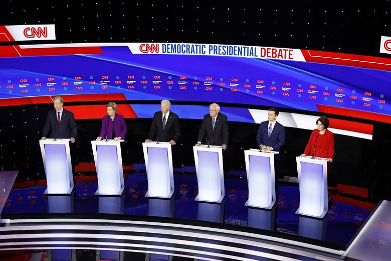 From left, Democratic presidential candidates businessman Tom Steyer, Sen. Elizabeth Warren, D-Mass., former Vice President Joe Biden, Sen. Bernie Sanders, I-Vt., former South Bend Mayor Pete Buttigieg, and Sen. Amy Klobuchar, D-Minn., stand on stage, Tuesday, Jan. 14, 2020, during a Democratic presidential primary debate hosted by CNN and the Des Moines Register in Des Moines, Iowa. (AP Photo/Patrick Semansky)