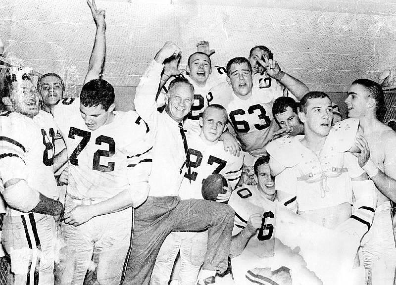 Georgia Tech football coach Bobby Dodd celebrates with his players after the Yellow Jackets' 7-6 upset of No. 1 Alabama in 1962. / Georgia Tech photo