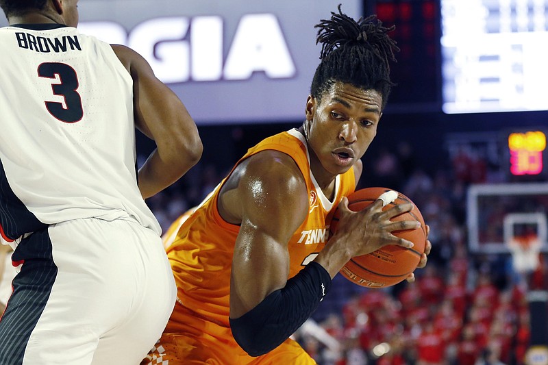 Tennessee's Yves Pons holds on to the ball after grabbing a rebound during the first half of Wednesday night's game at Georgia. / AP photo by Joshua L. Jones